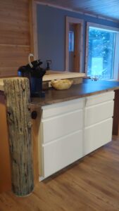 Concrete log post built into kitchen cabinet