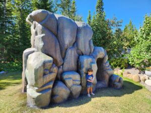 Concrete climbing rock with child in front