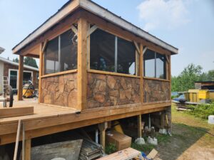 Carved stone base of deck enclosure
