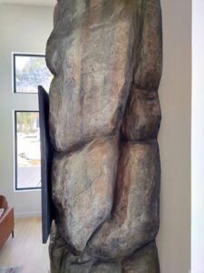 Side profile of concrete rock fireplace