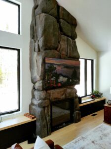 Concrete rock fireplace with painting