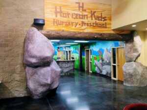 Concrete rocks and epoxy log in church foyer
